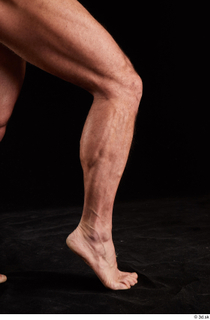 Larry Steel  1 calf flexing nude side view 0007.jpg